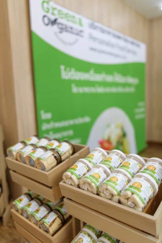 Fresh organic salads in jars displayed at Green & Organic store, promoting healthy eating and sustainable lifestyle.